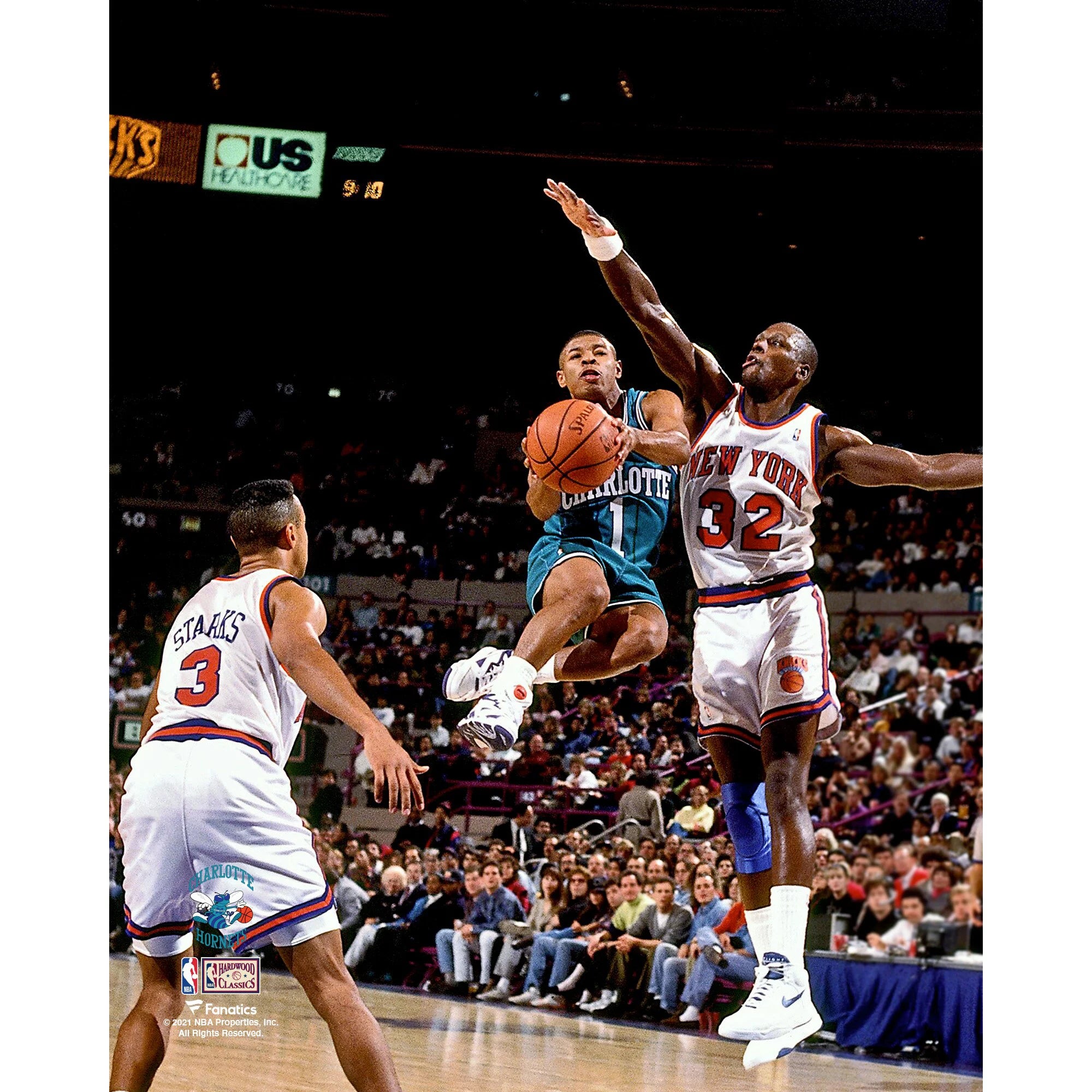 Muggsy Bogues Charlotte Hornets Unsigned Teal Jersey Mid-Air vs. New York Knicks Photograph